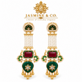 Pair of red and green Kashmiri-style earrings with pearl strands on white background
