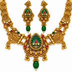 Close-up detail of gold-plated oval green stone necklace set and matching earrings