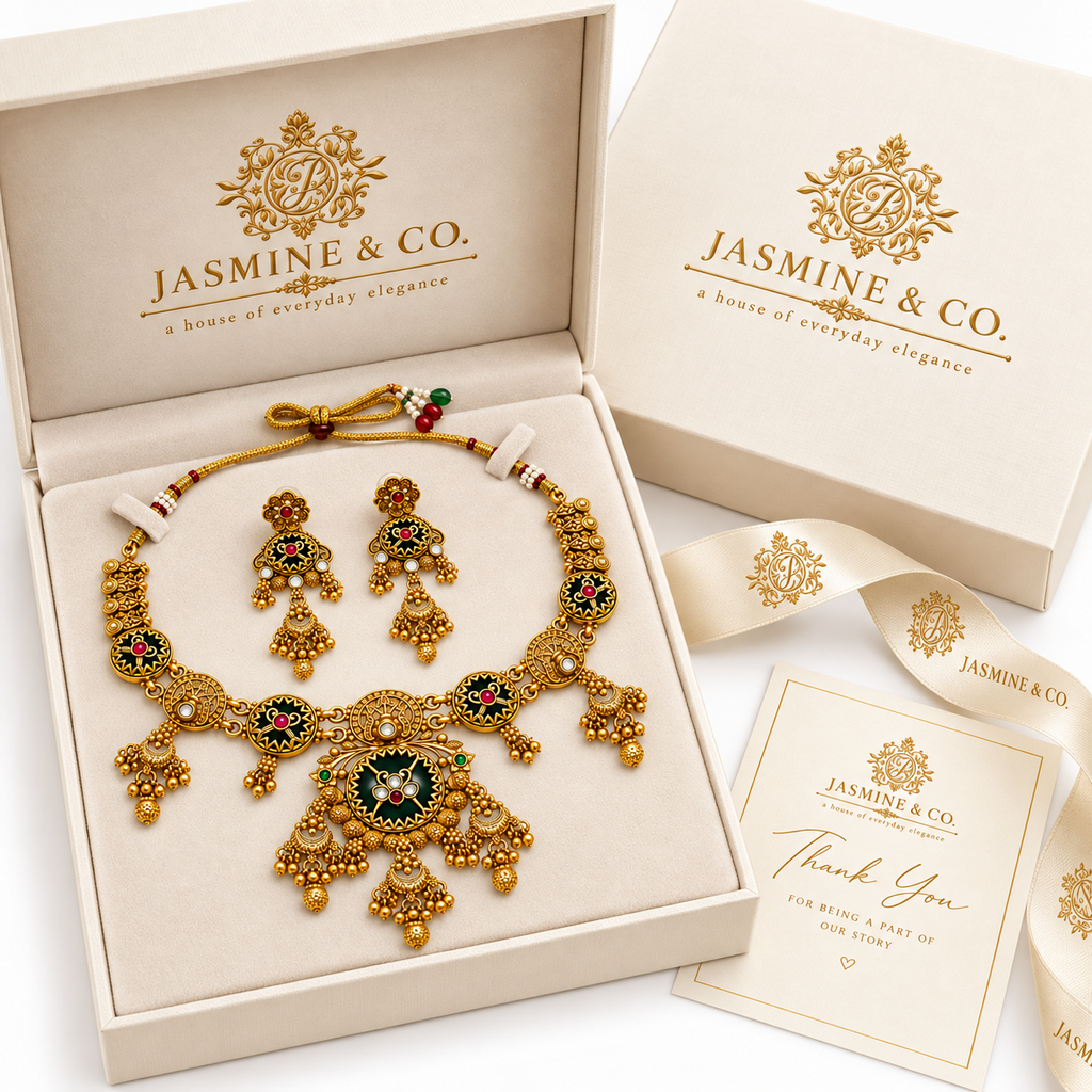 Gold-plated round green stone necklace set in Jasmine & Co. packaging box
