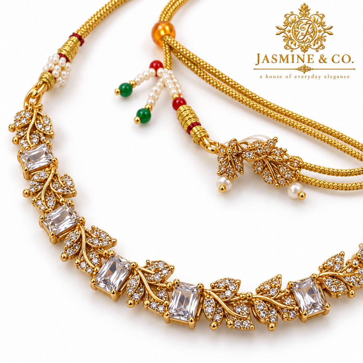 Close-up detail of gold-plated clear stone necklace set