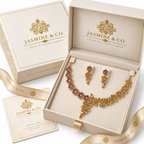 Fine stone gold-plated floral and leaf necklace set in Jasmine & Co. packaging box