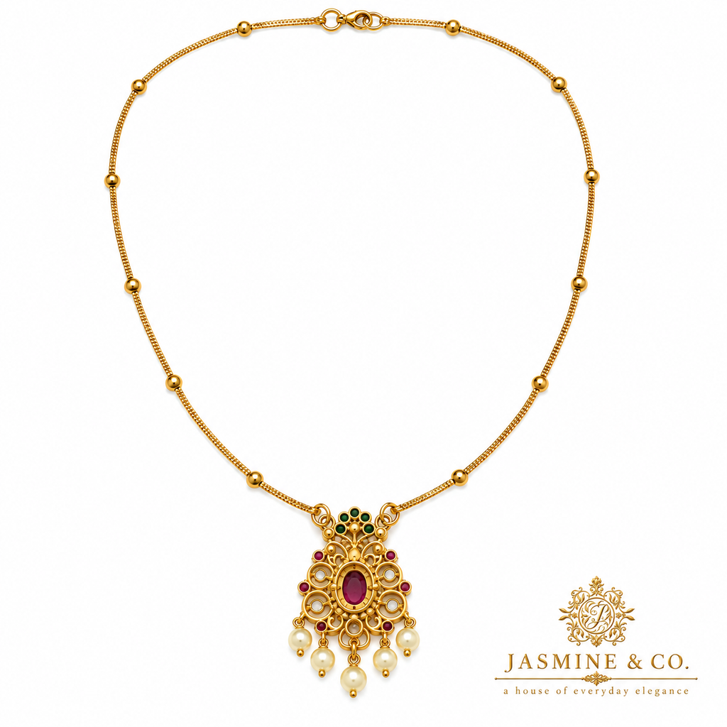 Back side view of gold-plated red stone pendant necklace