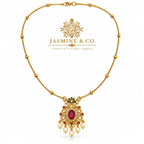 Red stone gold-plated pendant necklace included in Jasmine & Co. gift pack for Sister