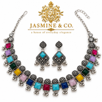 Full view of Jasmine & Co oxidized silver multicolor necklace and matching turquoise stone earrings