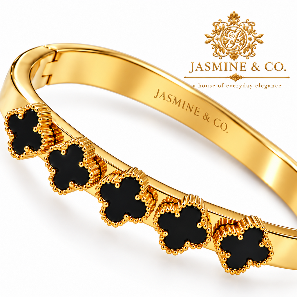 Jasmine & Co. close-up black clover details with textured golden borders