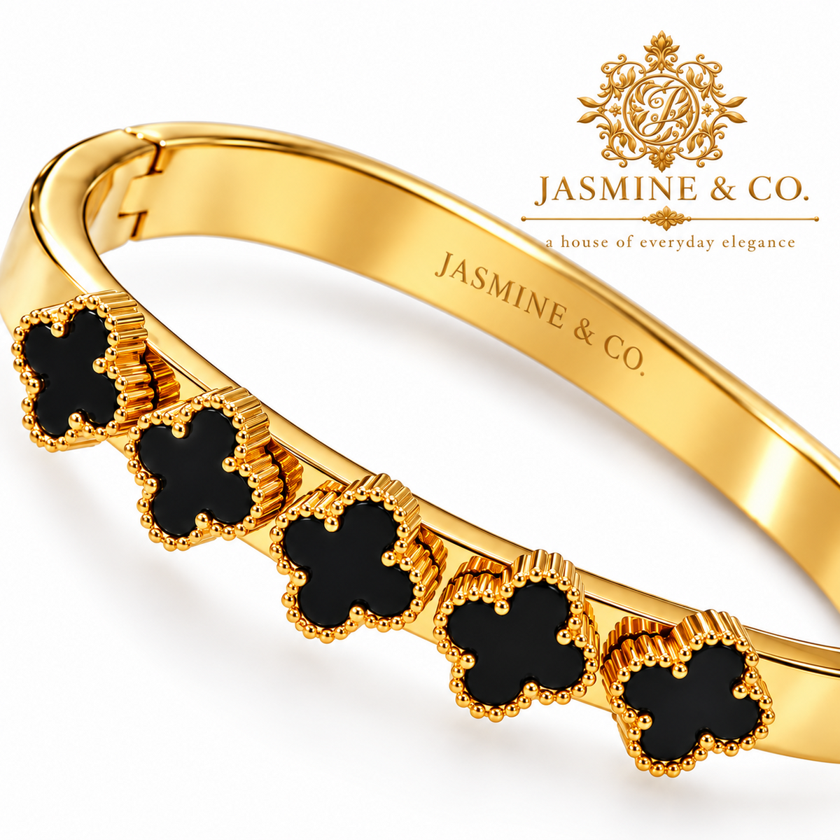 Jasmine & Co. close-up black clover details with textured golden borders